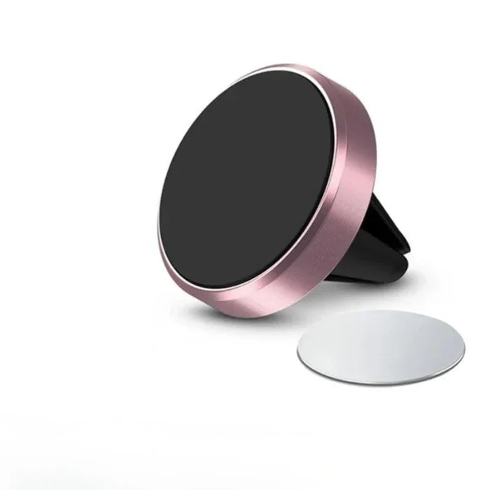 Rose gold magnetic car air vent phone holder with round metal plate on white background.